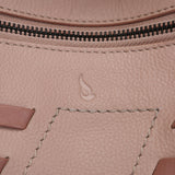 Crossbody bag with stitched details in pink leather