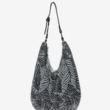 Hobo bag in metallic mesh with tropical print in black