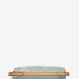 Convertible bag into a backpack in green die-cut leather