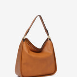 Umhängetasche aus recycelten Materialien in Cognac.
