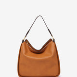Umhängetasche aus recycelten Materialien in Cognac.