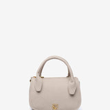 Kleine Handtasche aus recycelten Materialien in Beige.