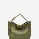 Handtasche aus recycelten Materialien in Grün.