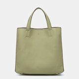 Einkaufsbeutel aus recycelten Materialien in Grün.