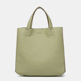 Einkaufsbeutel aus recycelten Materialien in Grün.