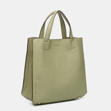 Einkaufsbeutel aus recycelten Materialien in Grün.