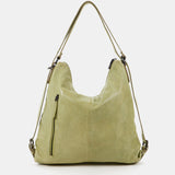 Bolso-mochila de mujer en piel troquelada verde