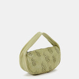 Women's handbag in green die-cut leather