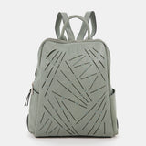 Damentasche aus grünem gestanztem Leder.