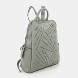 Damentasche aus grünem gestanztem Leder.