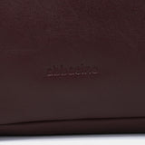 Bolso multifucional en piel burdeos