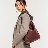 Bolso multifucional en piel burdeos