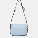 Bandolera en piel azul claro