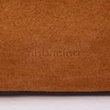 Bandolera en piel y serraje cognac