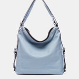 Bolso multifuncional en piel azul claro