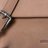 Beige leather crossbody bag.