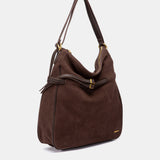 Mehrzwecktasche aus braunem Veloursleder.