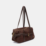 Schultertasche aus braunem Veloursleder.