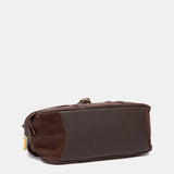 Schultertasche aus braunem Veloursleder.