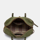 Grüne Schultertasche aus Veloursleder.