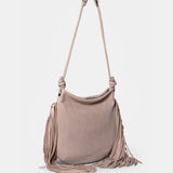 Shoulderbag aus Leder mit beigen Fransen.