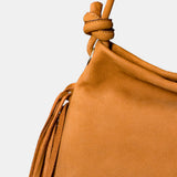Cognac leather shoulder bag with fringe detailing.
