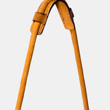 Cognac leather shoulder bag with fringe detailing.