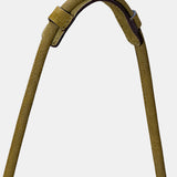 Schultertasche aus grünem Leder mit Fransen.