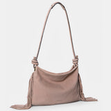 Beige leather shoulder bag with fringe detailing.