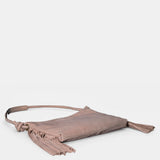Beige leather shoulder bag with fringe detailing.