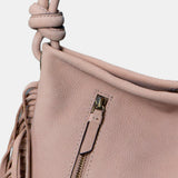 Beige leather shoulder bag with fringe detailing.