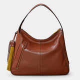 Bolso de hombro en piel troquelada cognac