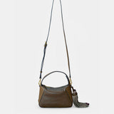 Bolso de mano en piel troquelada verde
