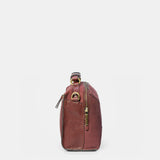 Burgundy suede crossbody bag.