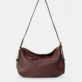 Burgundy suede shoulder bag.