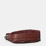 Burgundy suede shoulder bag.