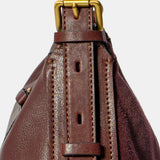 Burgundy suede shoulder bag.