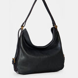 Multifunktionale schwarze Ledertasche.