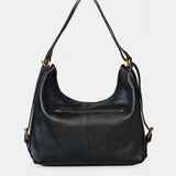 Multifunktionale schwarze Ledertasche.