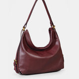 Bolso multifuncional en piel burdeos