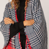 Reversible women's poncho in red and blue