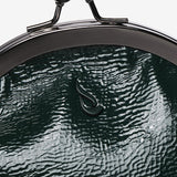 Patent leather shoulder bag in green