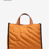 Shopper-Tasche aus recycelten und gepolsterten Materialien in Amber.