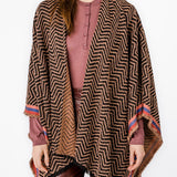 Poncho con estampado geométrico en tonos rosas