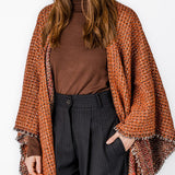Poncho in orange tones