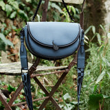 Half moon shoulder bag in blue recycled materials