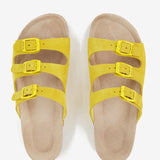 Women's flat leather sandal with triple buckle in yellow