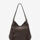 Braune Tasche-Rucksack aus recycelten Materialien.