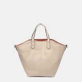 Umhängetasche für Damen, wendbar in Orange.