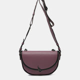 Bandolera media luna en materiales reciclados morada